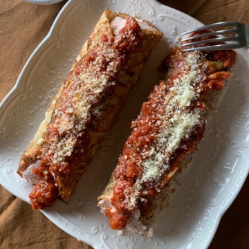 Canelones de Ricota y Jamón con Bologñesa
